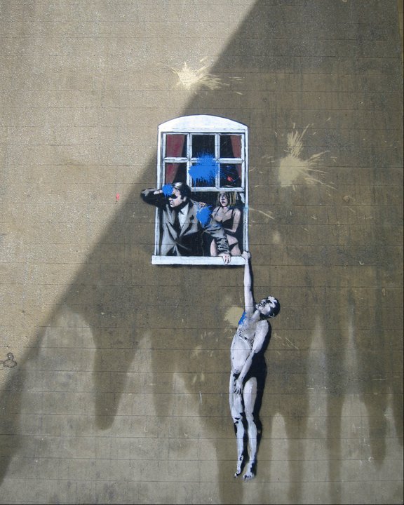 Banksy's Love Triangle. The city's reclaiming the space with blue paint bombs