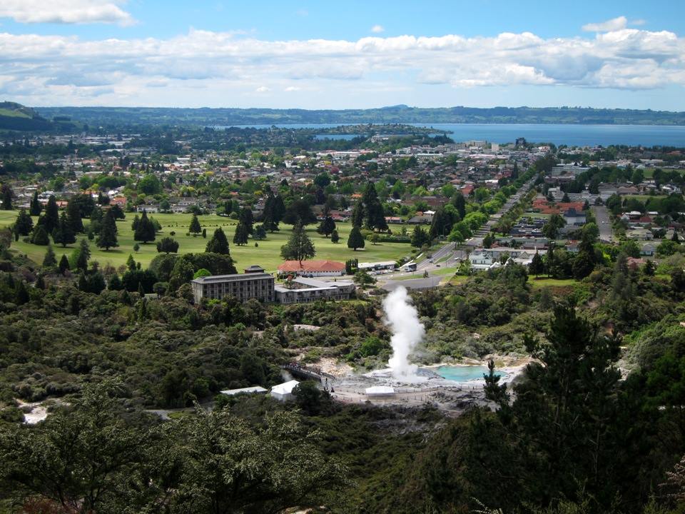 Pouhutu Geyser with Rotorua in the background